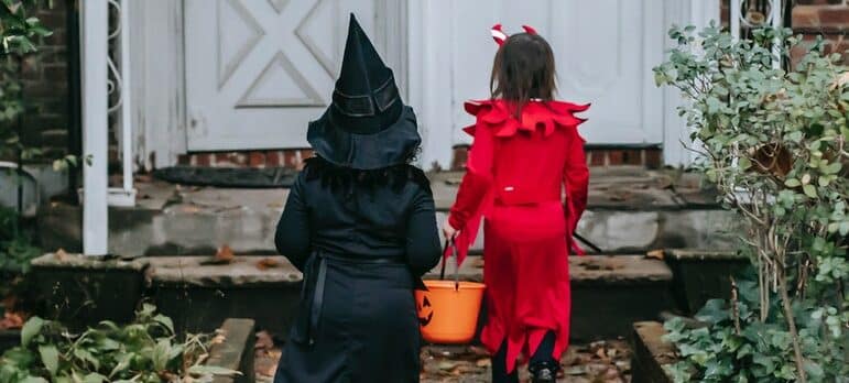a couple of kids going for trick-or-treat