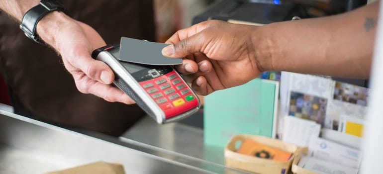 person paying with a card