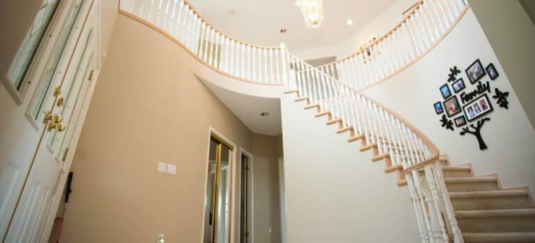 a big staircase inside a home with a high celling
