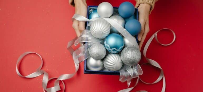 pack holiday ornaments for storage in a box