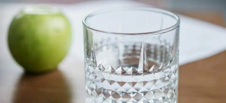 glass and an apple