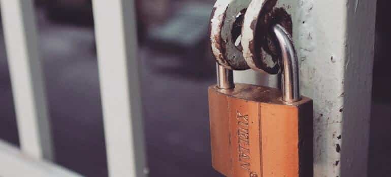 A padlock keeping a gate locked
