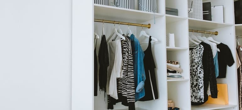 a closet with clothes in it