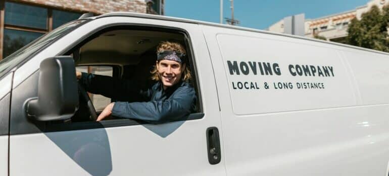 a man driving a moving truck