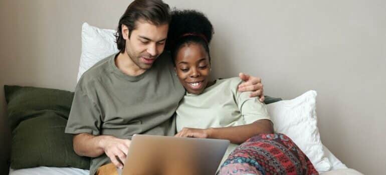 couple choosing a secure storage facility while on laptop