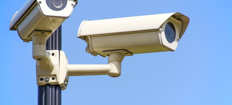 Two CCTV cameras mounted on post; 