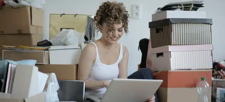 Women sitting with laptop with boxes around