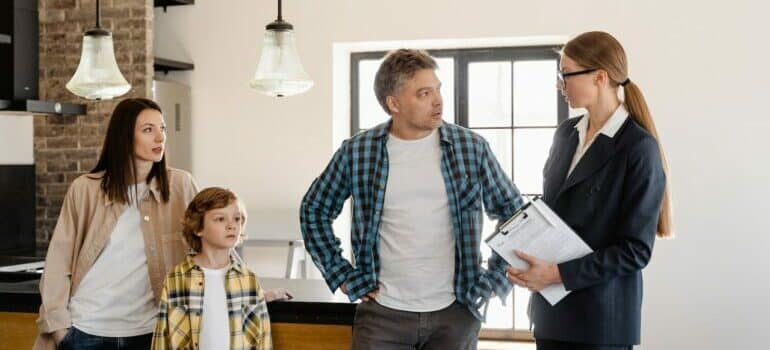 Family discussing home improvements to do before moving out of their Austin home with agent
