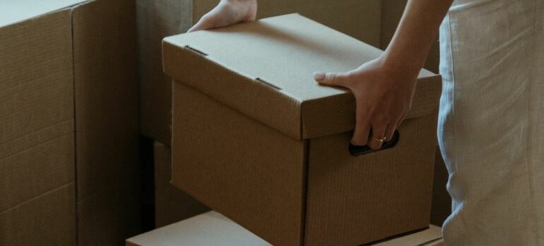 A person holding a box