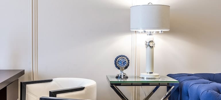Small pieces of furniture table with lamp, clock
