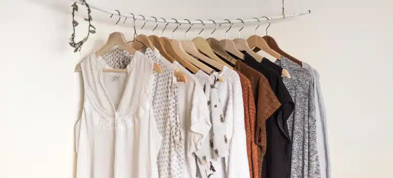 A pile of shirts on a shirt rack
